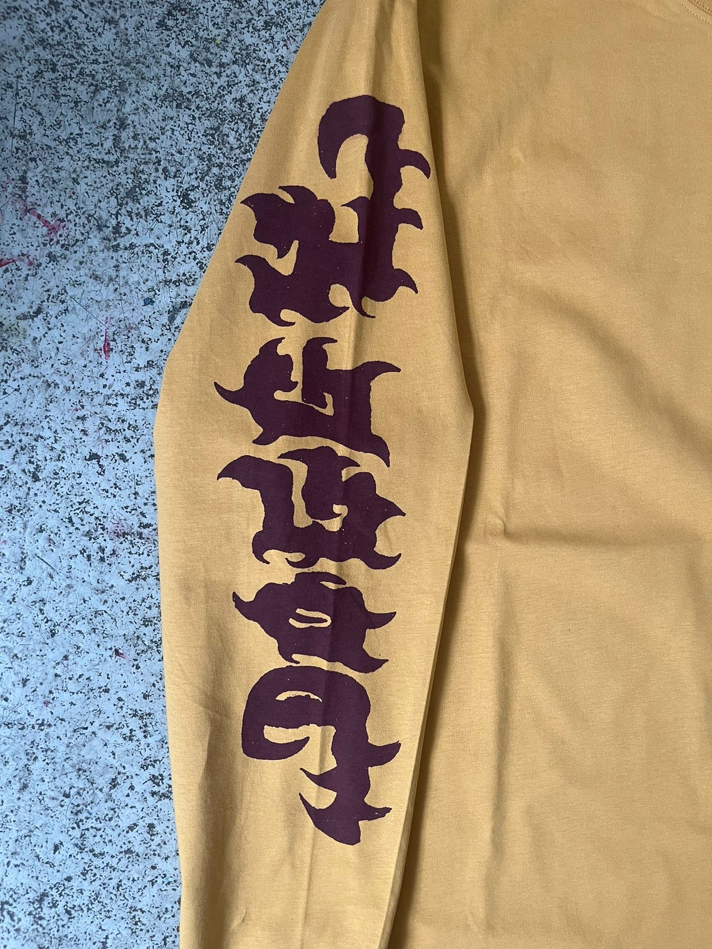 Sushi buffet long sleeve mustard